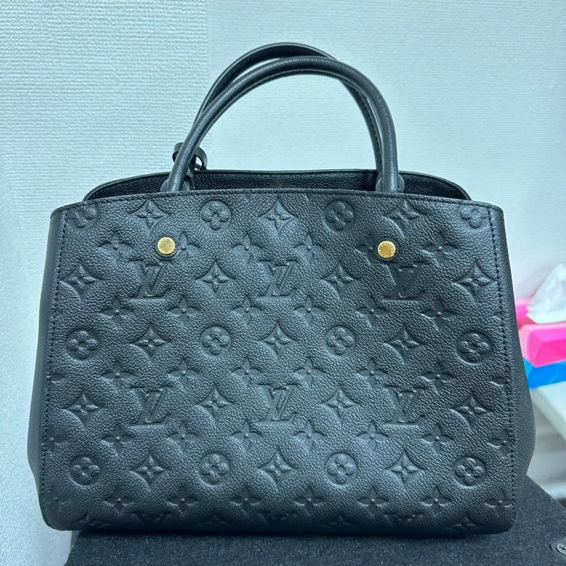 Louis Vuitton tote bags with a water - resistant coating for outdoor useLouis Vuitton Monogram Empreinte Montaigne MM Bag,Black,Leather