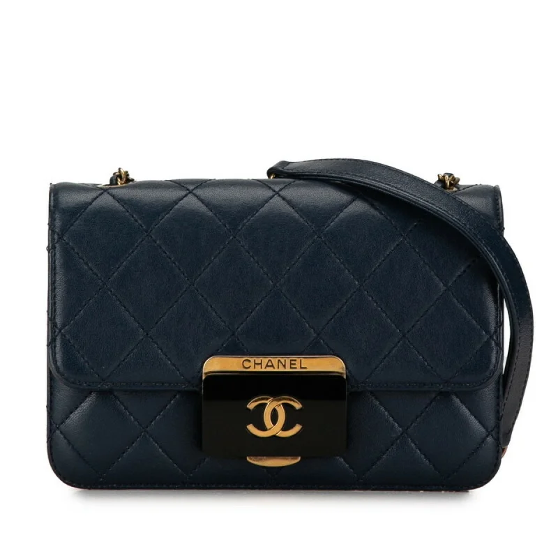 Chanel bags that pair perfectly with any outfitCHANEL Coco Mark Matelasse Shoulder Bag Navy Gold Lambskin Women's